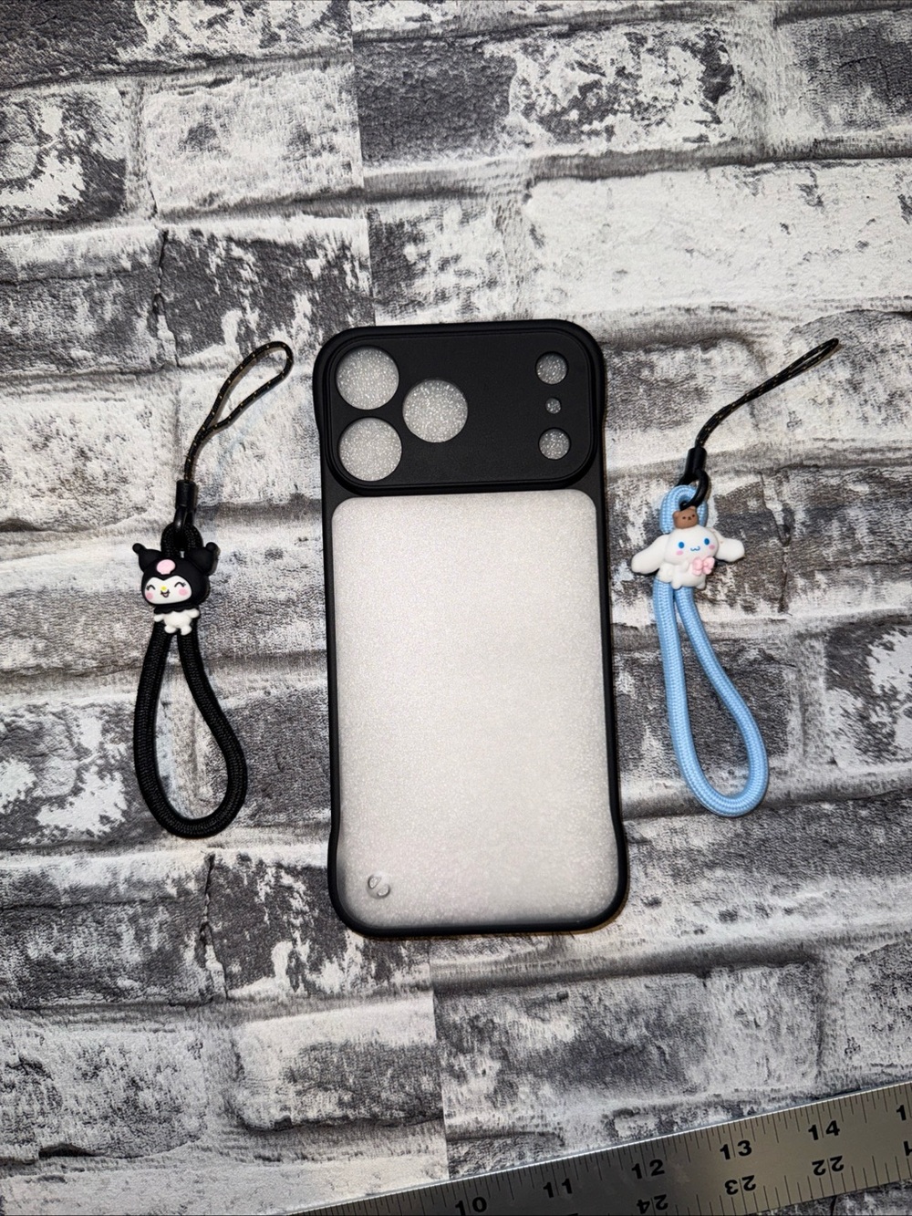 17 Pro Max Phone Case Matte Black featuring Kuromi and Cinnamoroll lanyards.